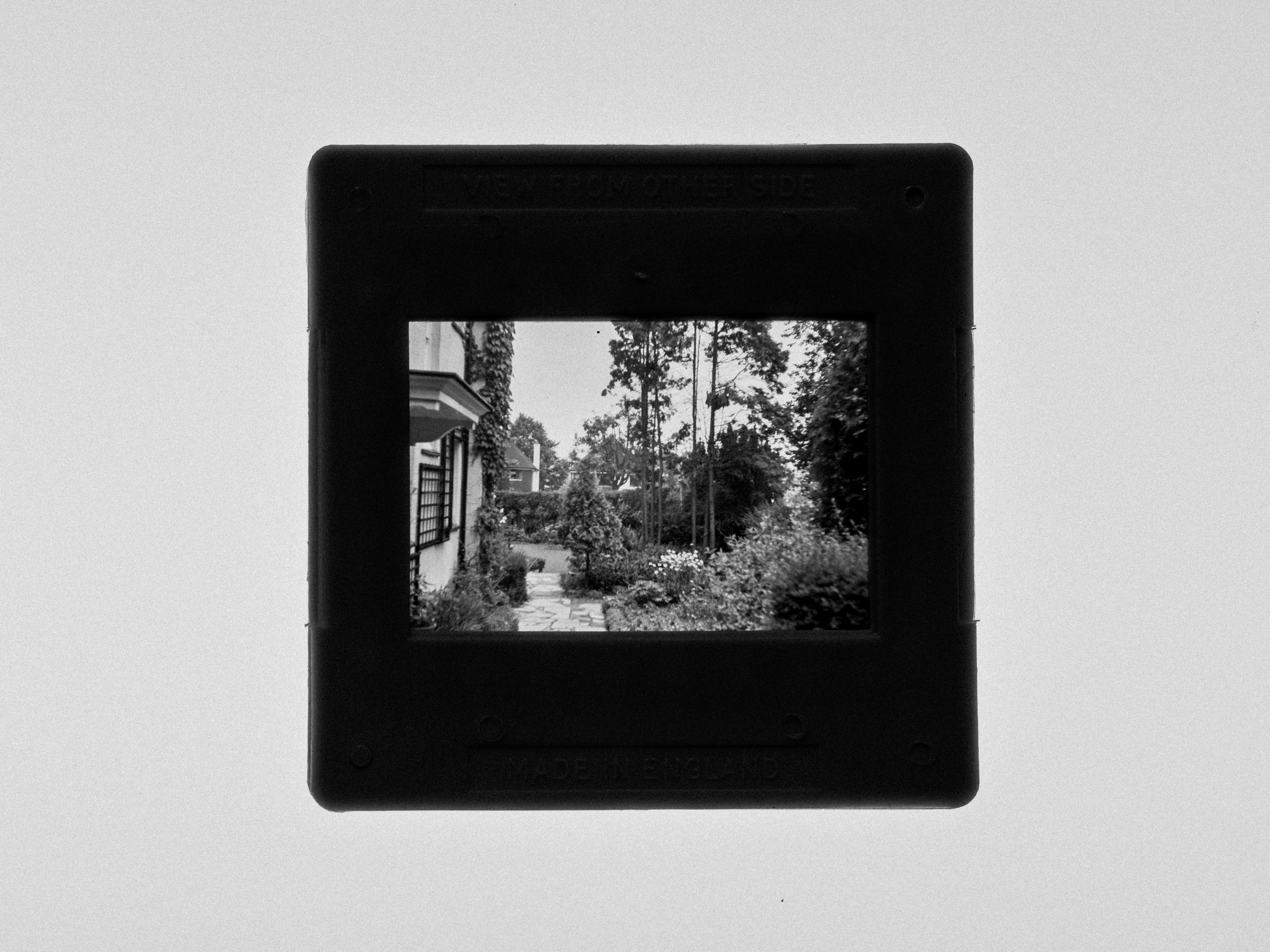 black wooden framed mirror on white wall